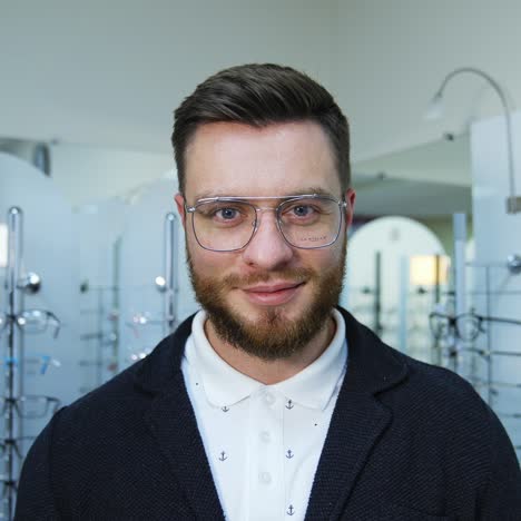man trying glasses at store