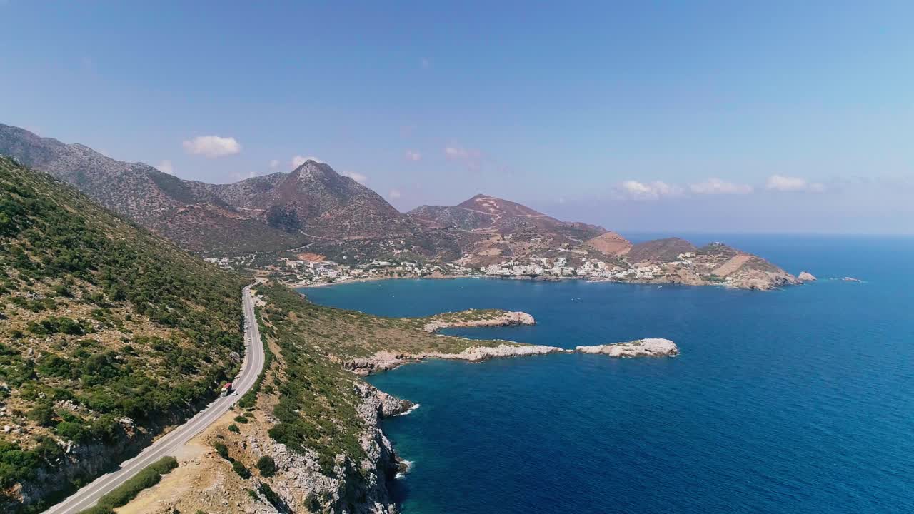 A shot from a drone of a road on the coast of the Greek island of Crete