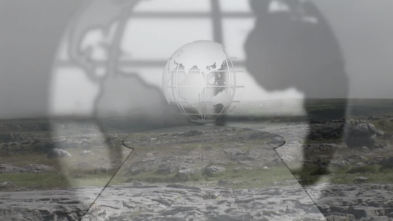 Wireframe globe hovering above rocky plateau, blurred hand silhouettes framing keyhole cutout
