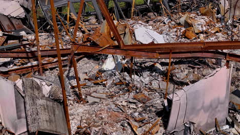 aftermath of a destructive fire showing a ruined building with charred debris