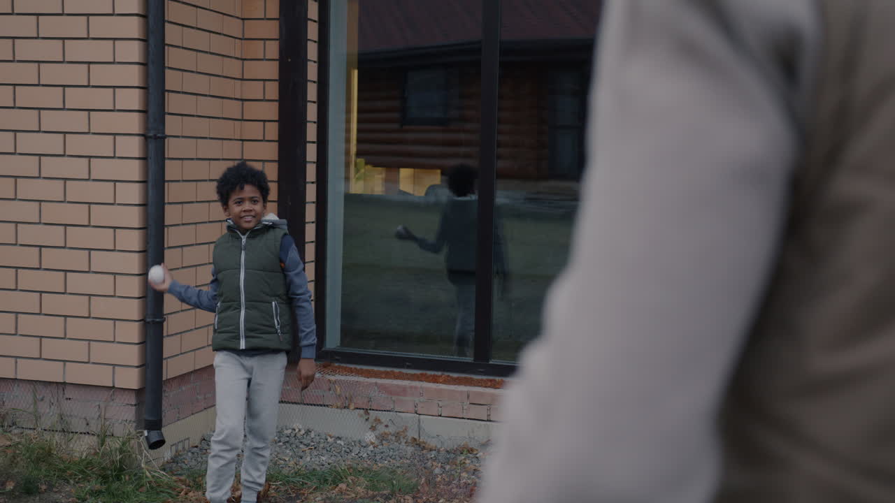 Child playing baseball outside
