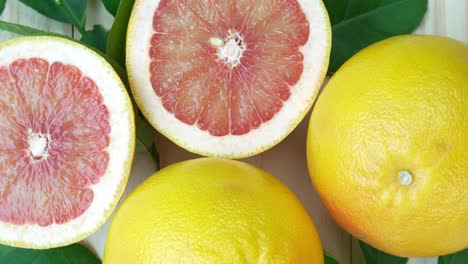 grapefruit with leaves in basket on wooden background, top view rotate grapefruit or  on wooden background, 4k resolution.