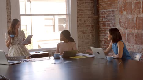 slow motion shot of creative brainstorming meeting in office