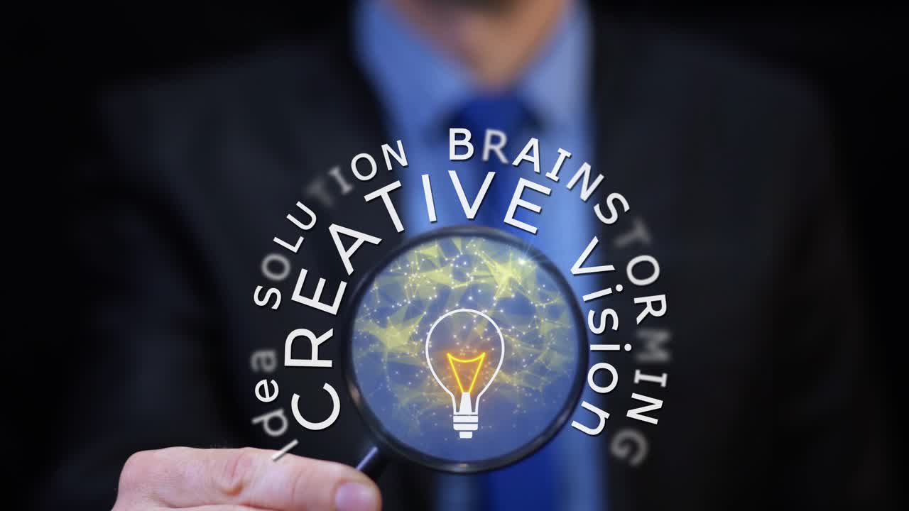 Close-up of businessman with magnifier revealing glowing light bulb and words: idea, vision, solution, creativity. 3D graphic animation