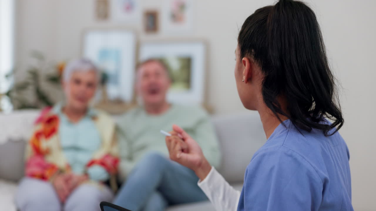Senior couple on sofa, consultation