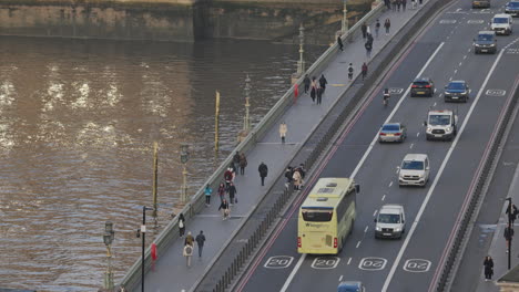 traffic and people crossing westminster bridge london