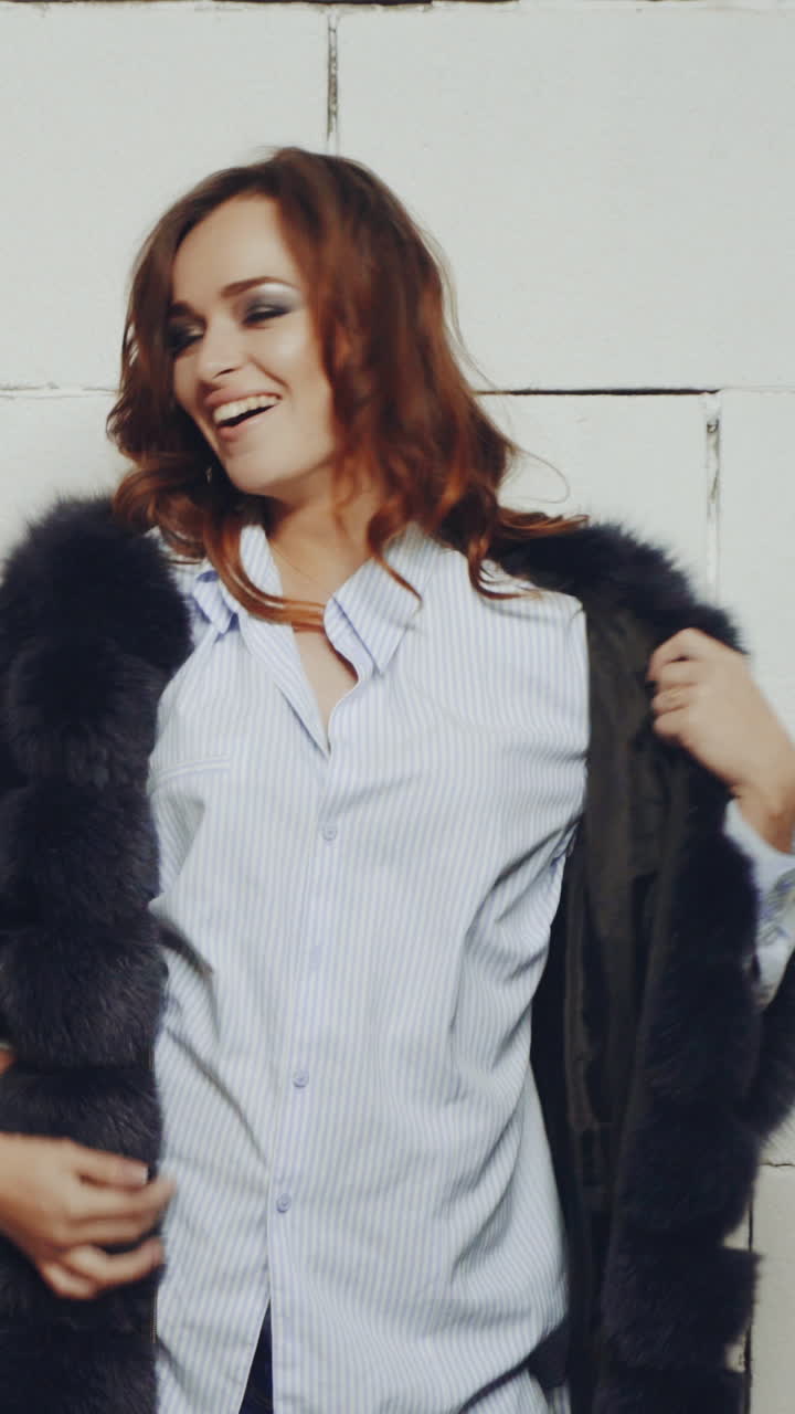 Woman posing in studio. Young fashion model girl posing in trendy wearing in studio