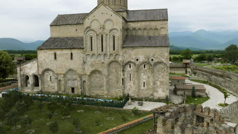 stone walls and cathedral of alaverdi orthodox monastery in georgia