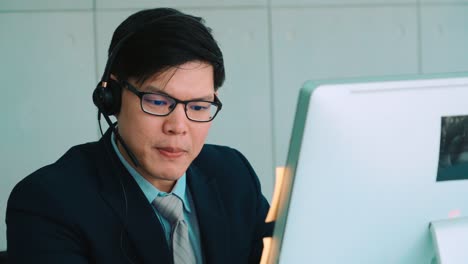 business people wearing headset working in office