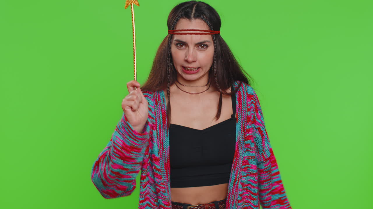 Magician witch wizard woman gesturing with magic wand making wish come true casting magician spell