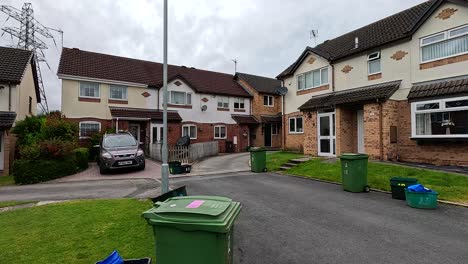 quiet neighborhood with houses and parked cars