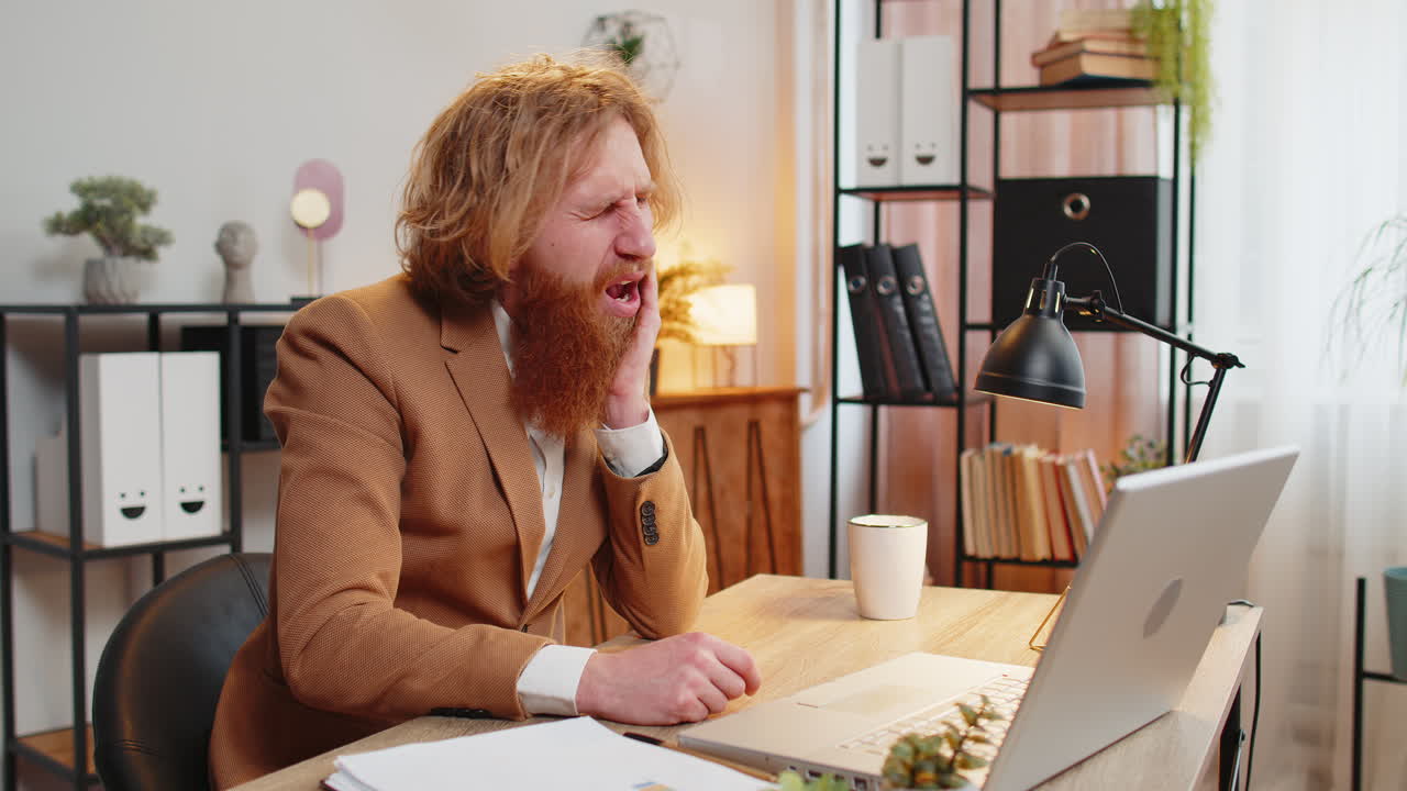 Businessman office freelancer working on laptop and feeling toothache touching mouth with hand