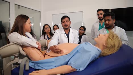 students engage in practical learning by using advanced medical mannequins for hands-on training in healthcare education.