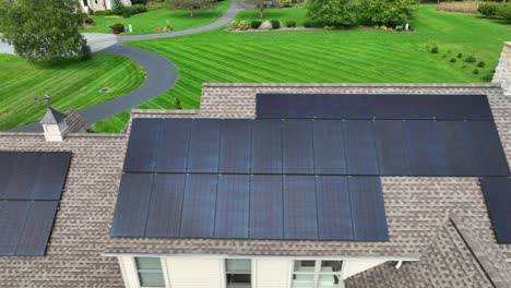 solar panels on american rooftop of house with well manicured lawn with stripes