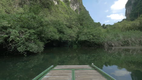 Boat-sailing-into-karst-cave-Trang-An-Vietnam