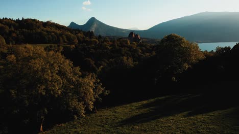 very-cinematic-view-of-a-castle-between-lake-and-mountains-in-the-Alps