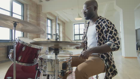 african american drummer enjoying playing drums