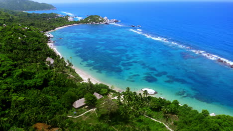 Aerial-drone-view-over-Tayrona-national-park-in-Santa-Marta,-Colombia,-South-America