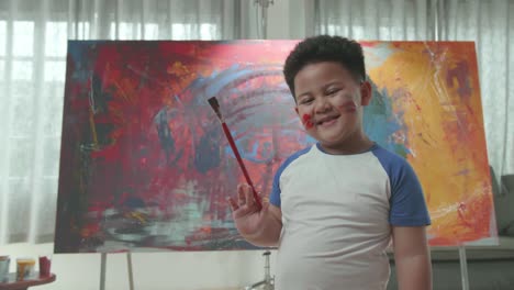 child having fun with painting
