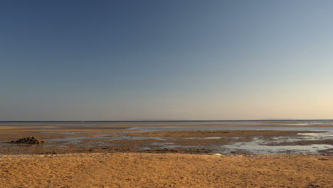 excited man running on the beach