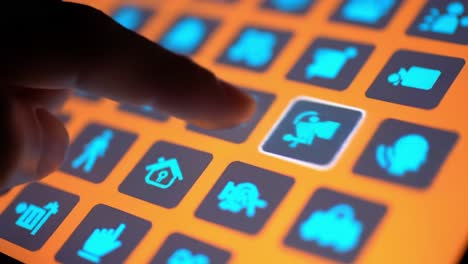 navigating a touchscreen interface: engaging interaction with colorful icons and controls on an orange background