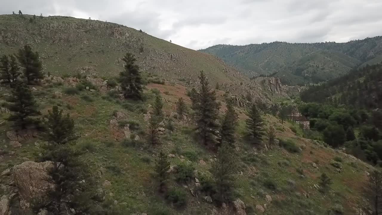 Aerial flight at the crest of desolate mountain tops in Colorado