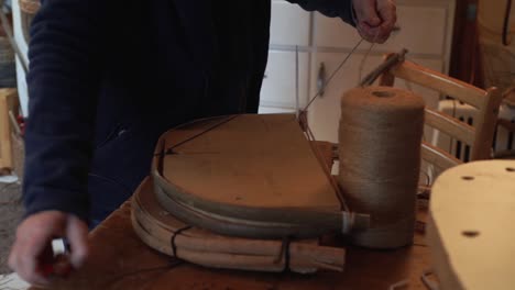 a basketmaker makes a frame to use for shaping a traditional welsh basket