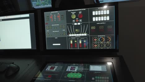 a close-up of a modern ship bridge simulator's control station, featuring multiple monitors and a large touch screen displaying complex system data and controls