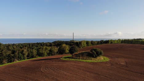 aerial view of fields with burial mounds and brown mold close to sejerøbugten in odsherred