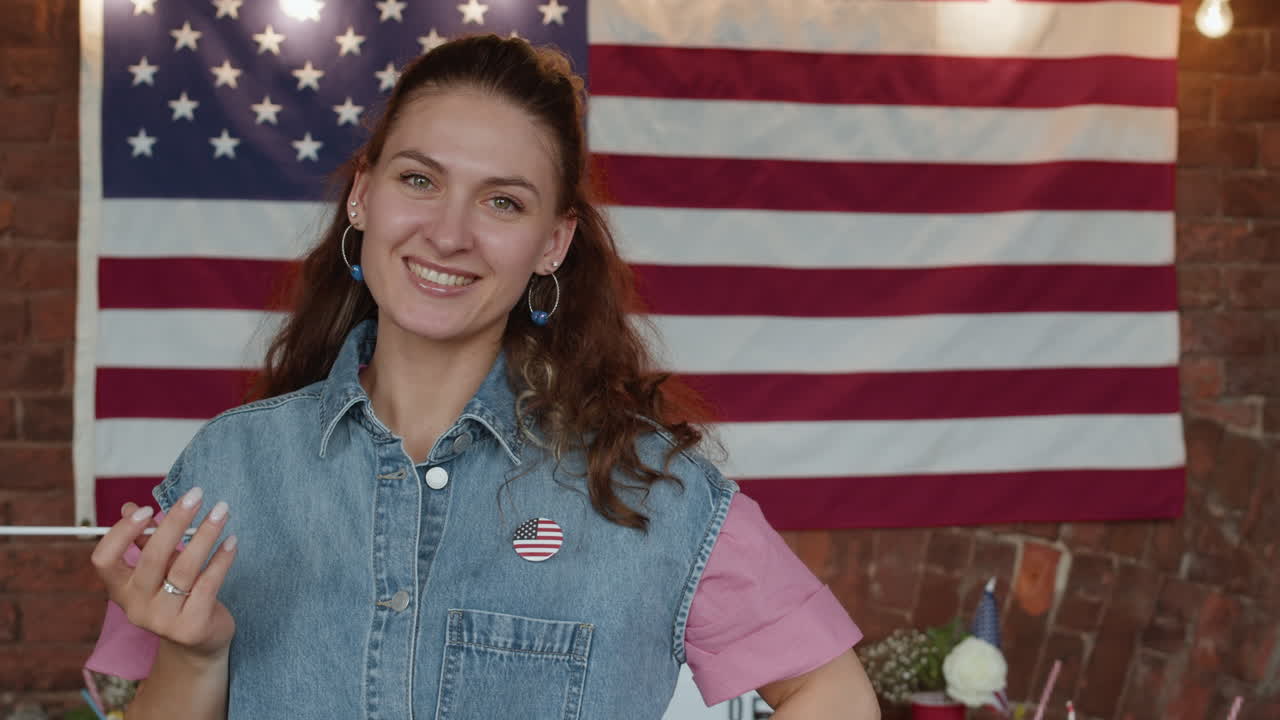 Woman Smiling at the American Flag