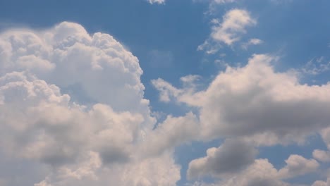 timelapse of white clouds drifting across a clear blue sky