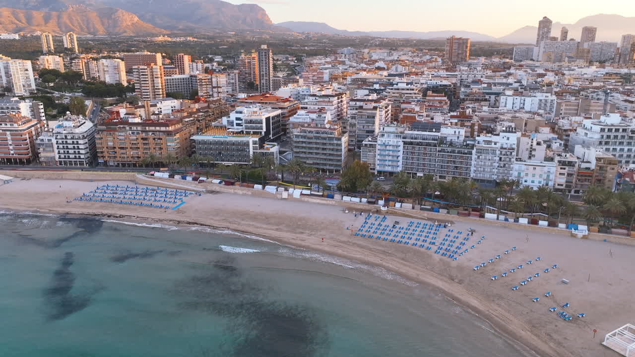 Flight descends to sea off Benidorm's famous Ponient Beach and dense cityscape