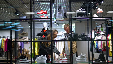 couple shopping for shoes in a modern retail store