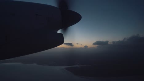 aerial view of airplane propeller over dark cloudy sky