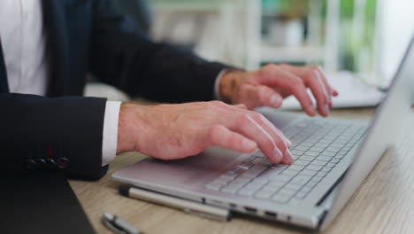 businessman writing on laptop