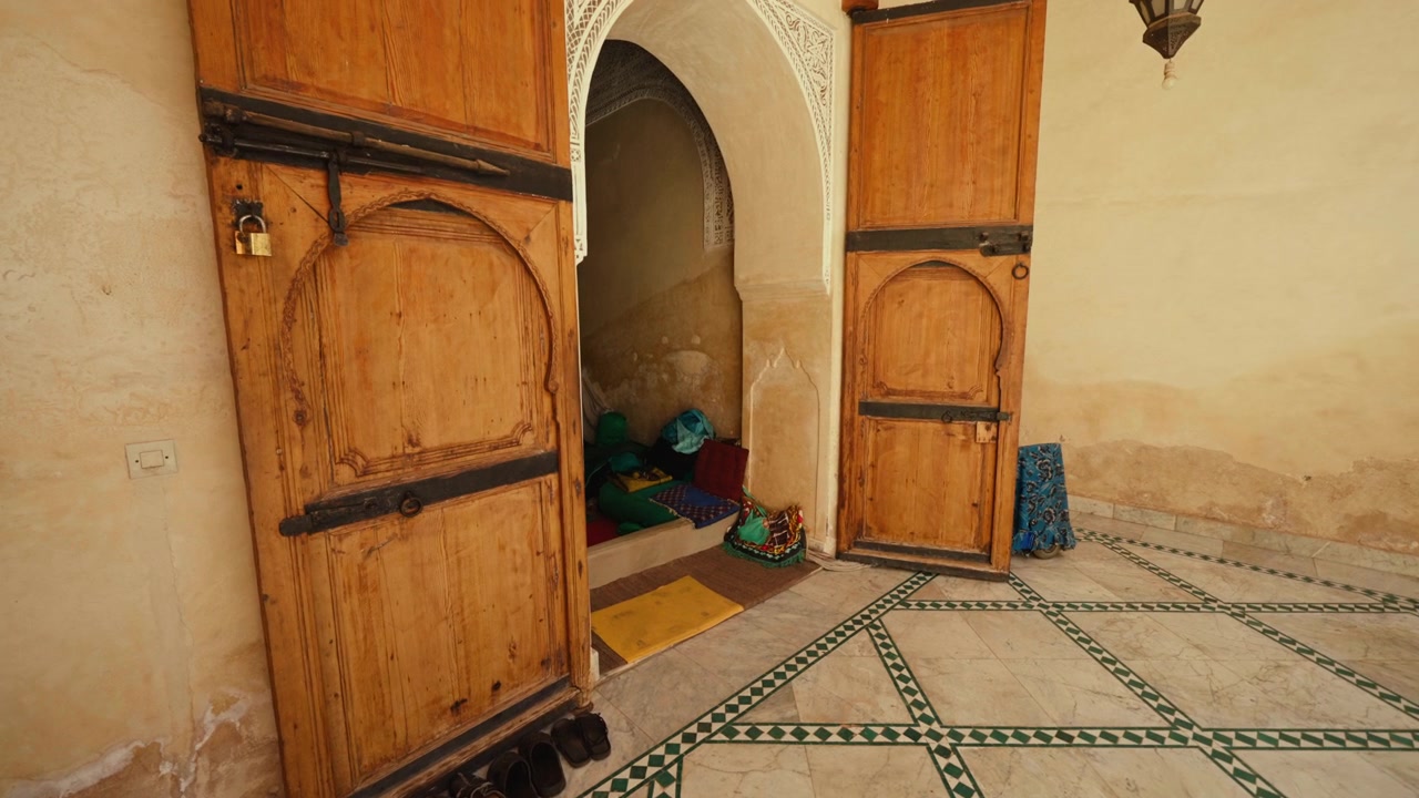 Traditional Moroccan Interior with Ornate Wooden Doors and Tiled Floor