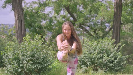 active blond young lady doing yoga