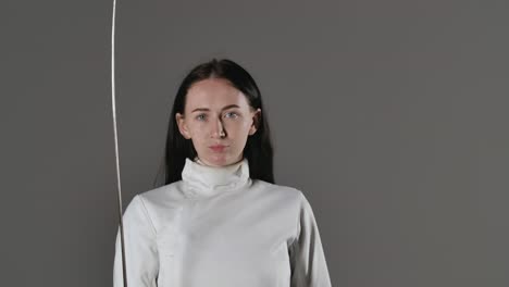 Female Fencer in Foil Uniform
