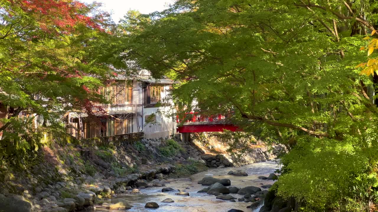 Stunning fall color scenery at Shuzenji Onsen with river in Japan