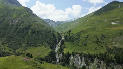 crane drone shot of a river in the swiss alps