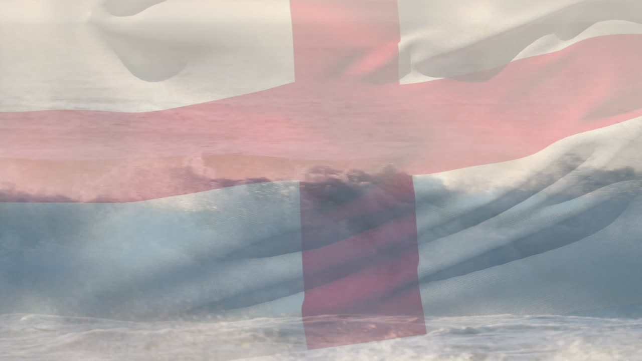 composición digital de agitar la bandera de inglaterra contra las olas en el mar