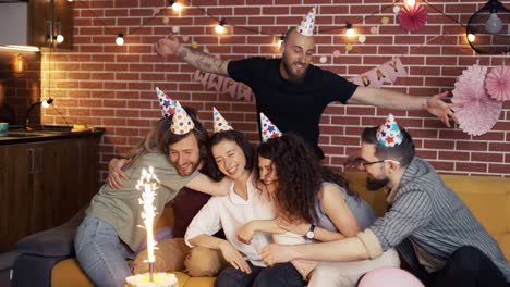 birthday girl enjoying celebration with best friends with cake and hugs