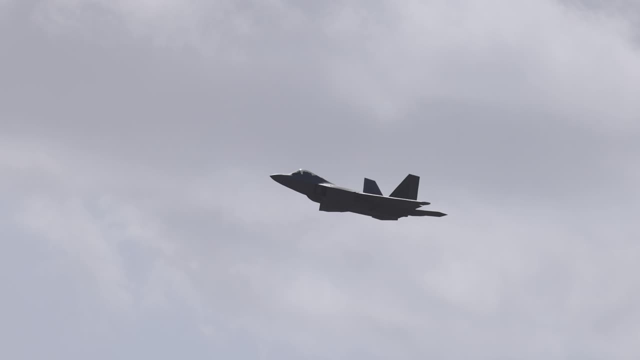 F-22 Raptor performs aerial maneuvers against a cloudy sky at Avalon Airshow in Geelong, showcasing its stealth and agility