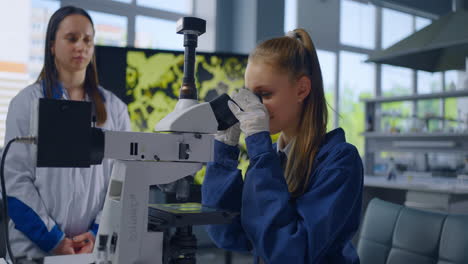 students using a microscope in a science lab