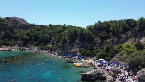 anthony quinn bay in faliraki, rhodes in greece during the day with crystal clear water