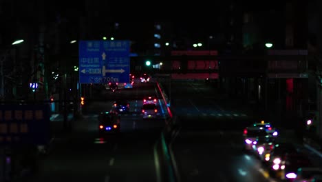 a night timelapse of the miniature traffic jam at the city street in tokyo