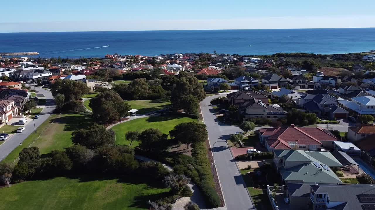 Dolly Left Aerial View Over Lighthouse Park With Ocean In Background, Mindarie Perth