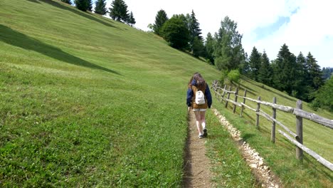 A-Woman-hiking-through-a-mountain-4K