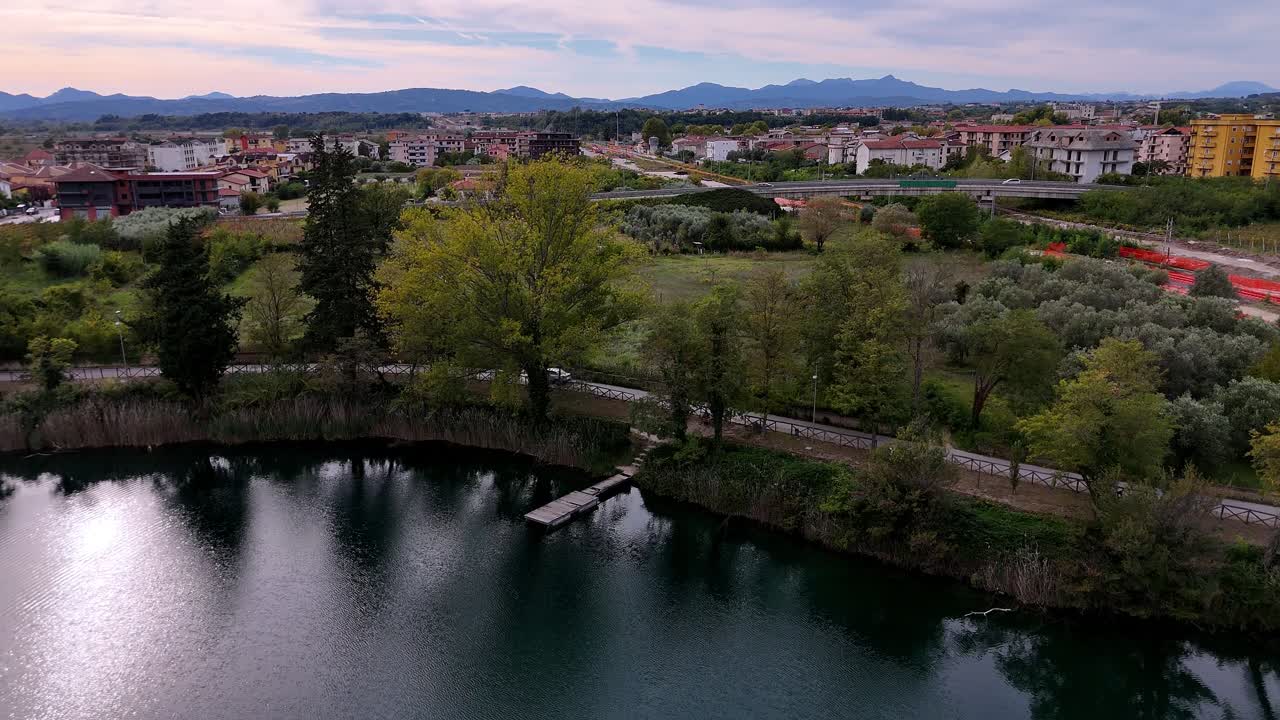 Lago Telese Drone Flight at Winter Sunset Over Calm Waters in Campania, Italy