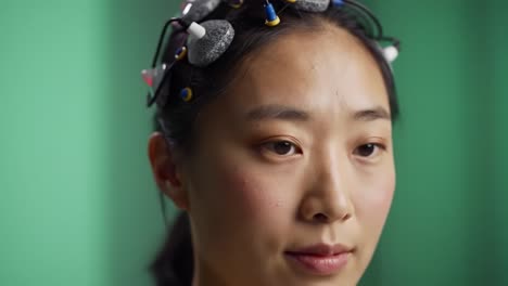 a captivating transformation: exploring the art of hair styling and makeup application through intimate close-ups of a subject with hair rollers